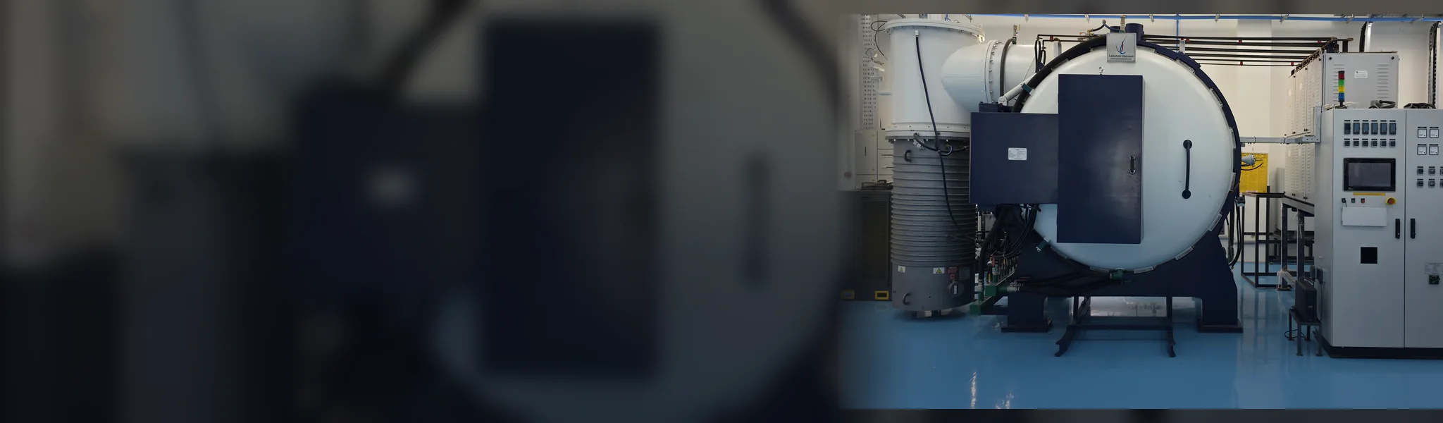 Vacuum furnace with its control cabinet at a Lakshmi Vacuum installation